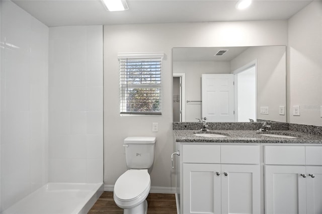 bathroom featuring hardwood / wood-style floors, vanity, and toilet