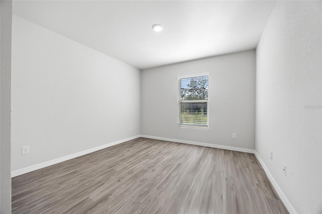 spare room featuring light hardwood / wood-style floors