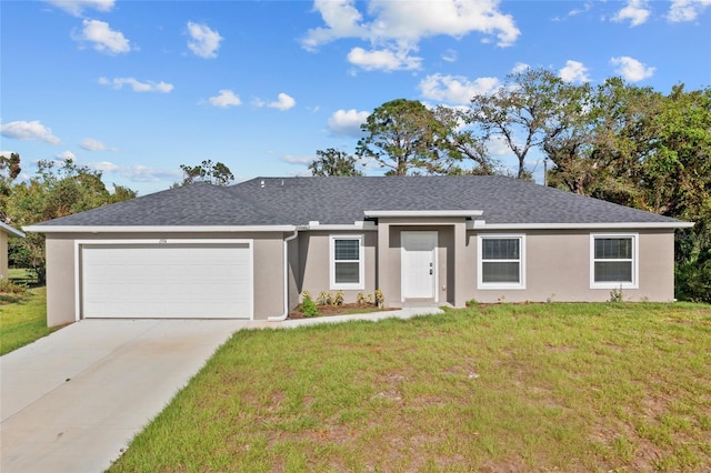 ranch-style house featuring a front yard and a garage