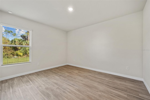 unfurnished room featuring light hardwood / wood-style floors