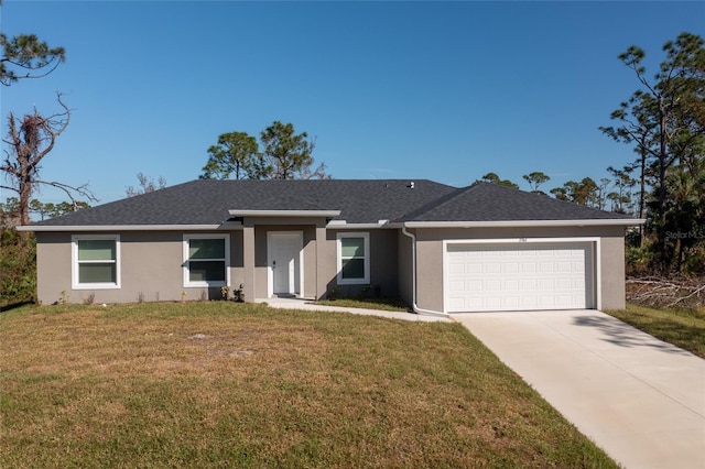 single story home featuring a garage and a front yard