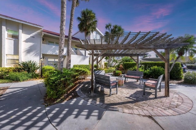 view of property's community featuring a patio area and a pergola