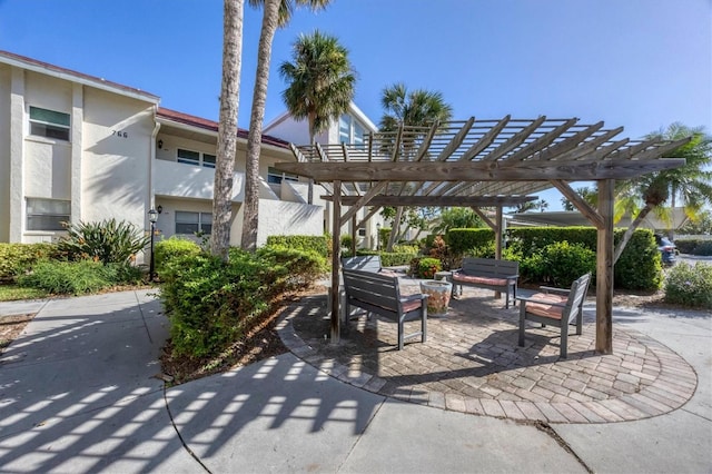 surrounding community with a patio area and a pergola