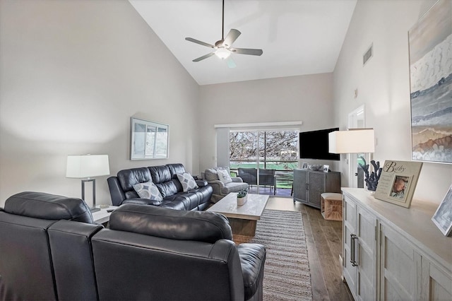 living room featuring ceiling fan, high vaulted ceiling, and dark hardwood / wood-style floors