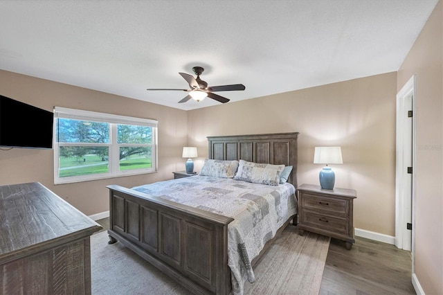 bedroom featuring light hardwood / wood-style floors and ceiling fan