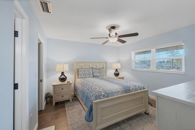 bedroom featuring light wood-type flooring and ceiling fan