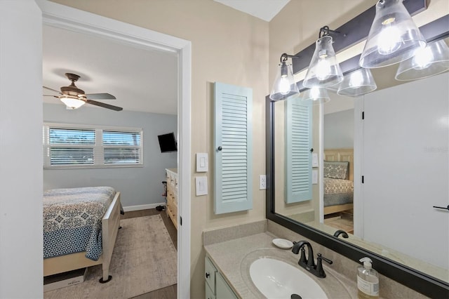 bathroom featuring vanity, wood-type flooring, and ceiling fan