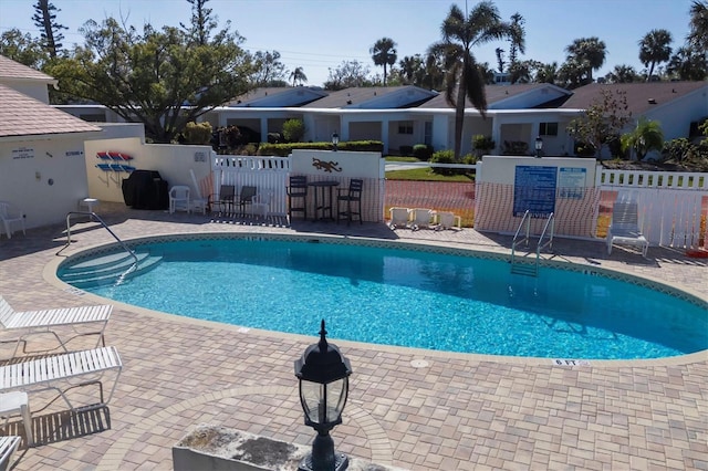 view of swimming pool featuring a patio area