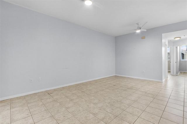 unfurnished room with ceiling fan and light tile patterned flooring