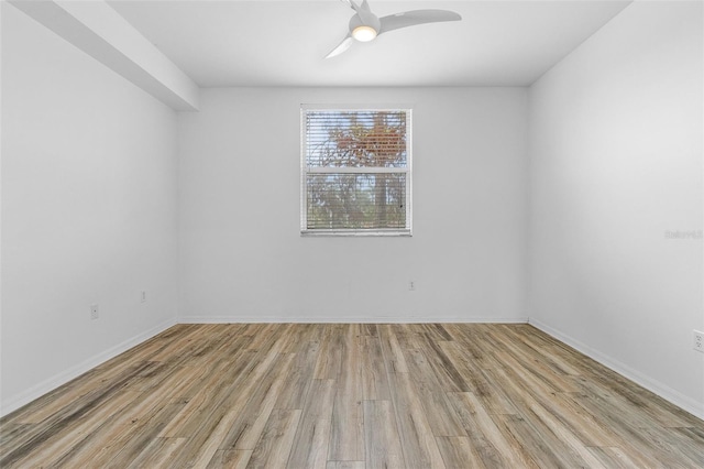 empty room with ceiling fan and light wood-type flooring