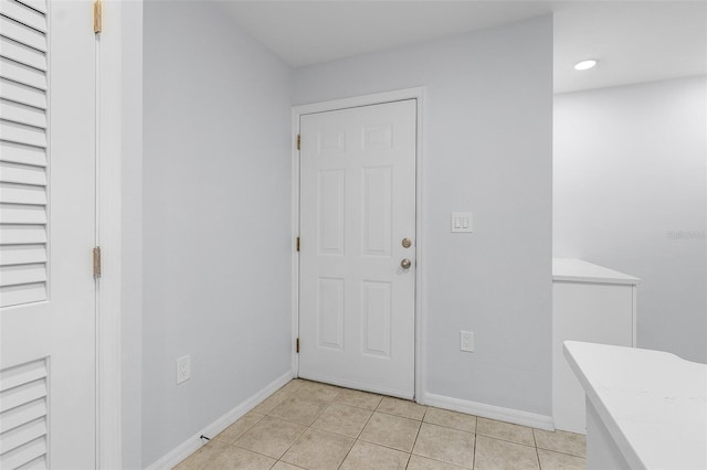 foyer entrance featuring light tile patterned flooring