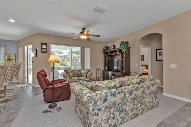 living room featuring ceiling fan and carpet floors