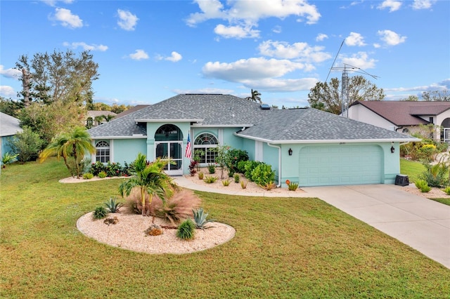 ranch-style house with a garage and a front yard