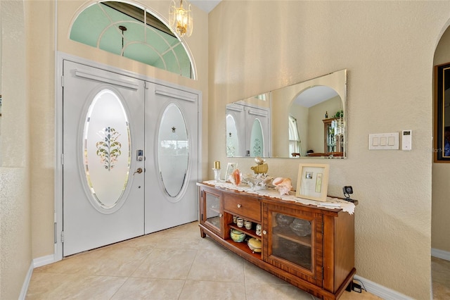 tiled entrance foyer with french doors