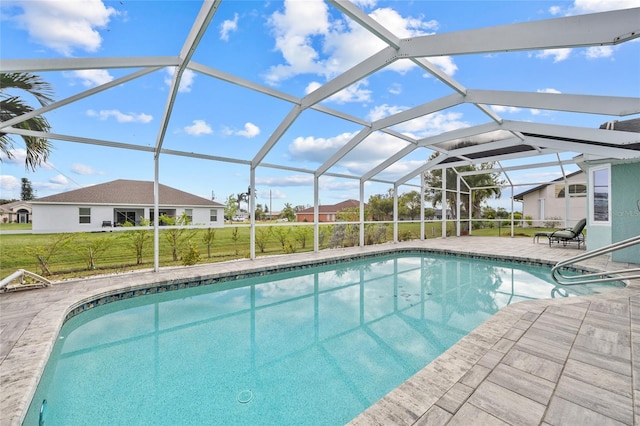 view of swimming pool with a lanai, a yard, and a patio area