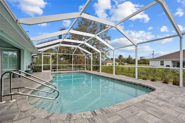 view of pool with a lanai and a patio