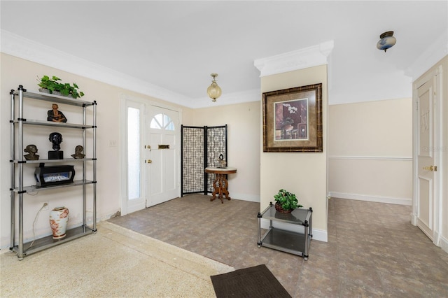 foyer entrance featuring crown molding