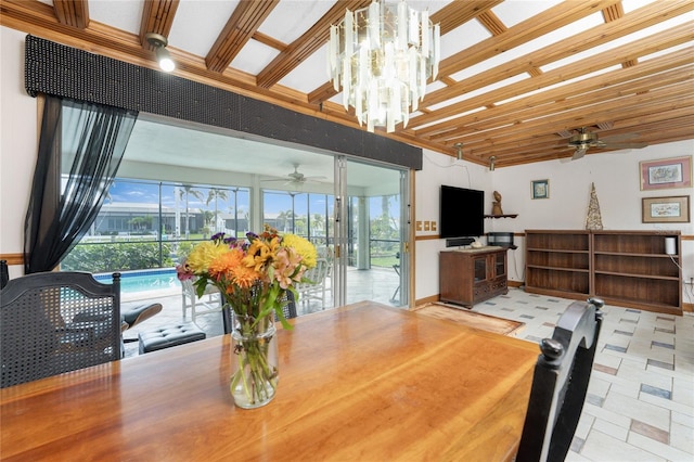 dining room featuring ceiling fan with notable chandelier