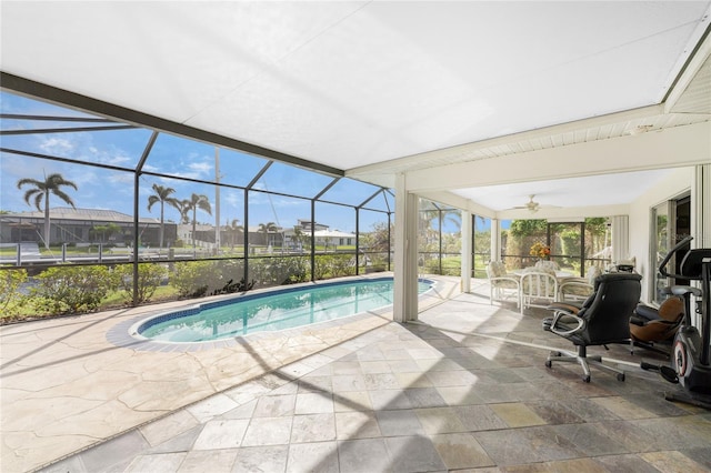 view of pool featuring a patio, a lanai, and ceiling fan