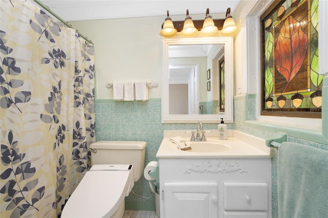 bathroom with tile patterned floors, toilet, tile walls, vanity, and a shower with shower curtain