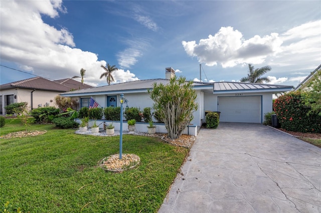 single story home featuring a garage and a front yard