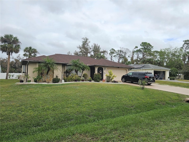 view of front of property featuring a garage and a front lawn