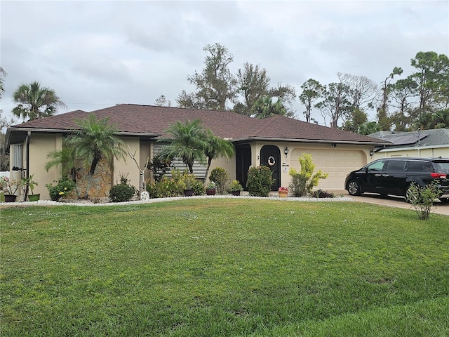 single story home with a garage and a front lawn