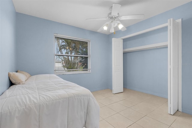 tiled bedroom with ceiling fan