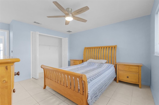 tiled bedroom with a closet and ceiling fan