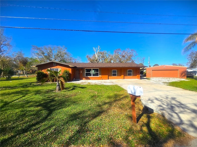 single story home featuring a garage and a front lawn