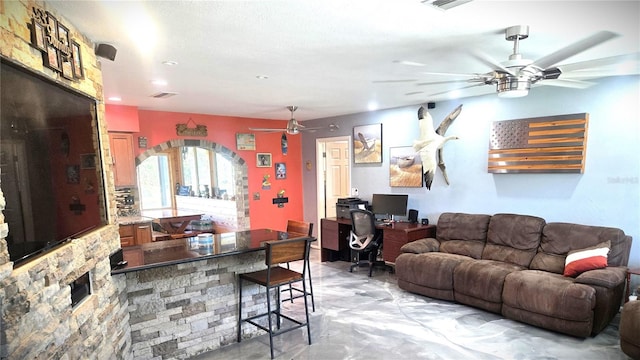 living room featuring ceiling fan