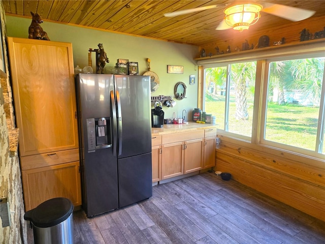 kitchen with wood ceiling, dark hardwood / wood-style flooring, ceiling fan, stainless steel fridge with ice dispenser, and wood walls