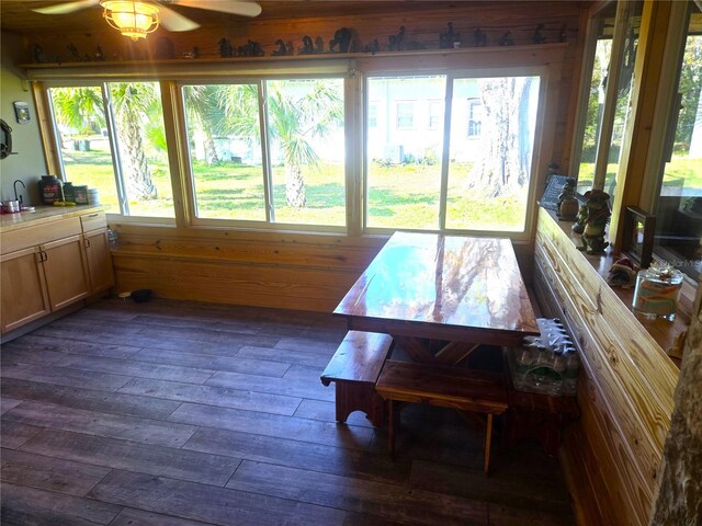 sunroom / solarium with ceiling fan and a wealth of natural light