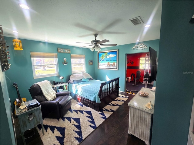 bedroom featuring ceiling fan and dark hardwood / wood-style flooring