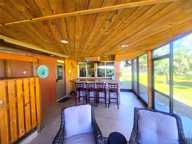 sunroom with wood ceiling