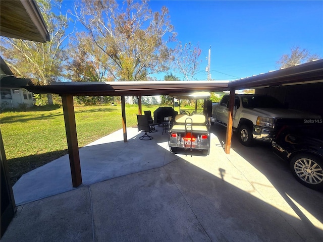 view of parking / parking lot featuring a yard and a carport