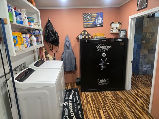 laundry area with washer and dryer and dark hardwood / wood-style floors