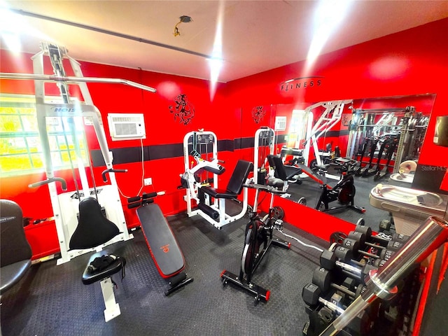 workout area with an AC wall unit