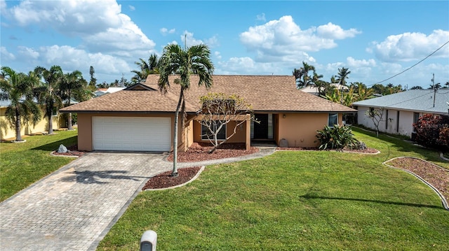 ranch-style home featuring a garage and a front lawn