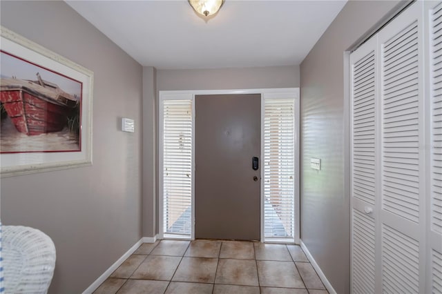 tiled foyer entrance featuring a wealth of natural light