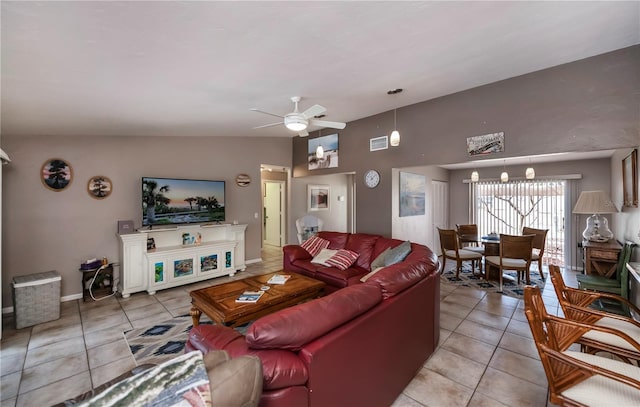 living room with light tile patterned floors, vaulted ceiling, and ceiling fan