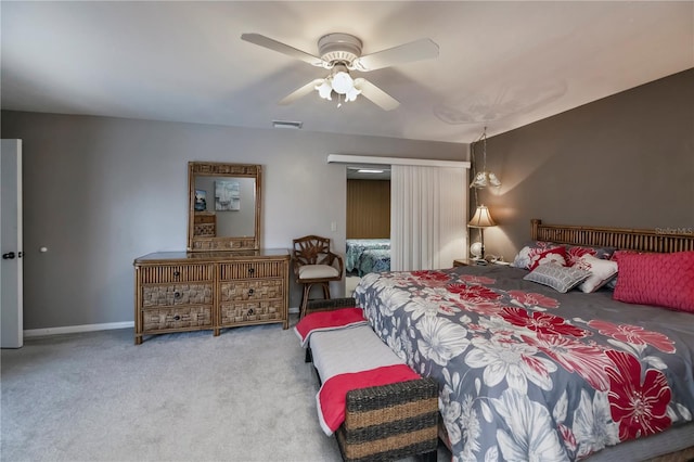 bedroom with ceiling fan and light colored carpet