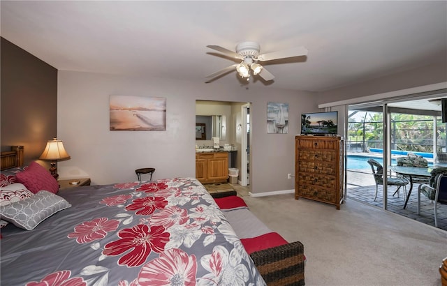 bedroom featuring ensuite bath, light carpet, access to exterior, and ceiling fan