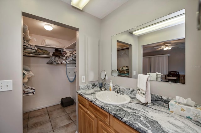 bathroom with vanity, ceiling fan, and tile patterned floors