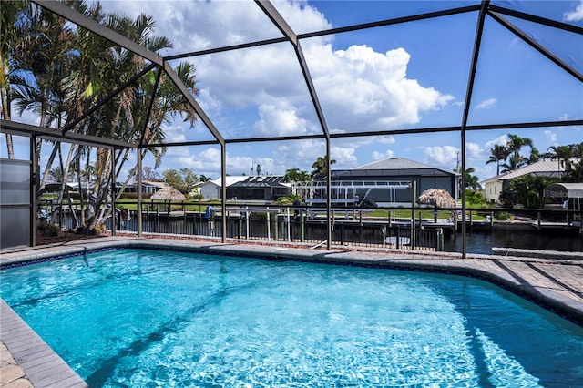 view of pool featuring a water view and a lanai