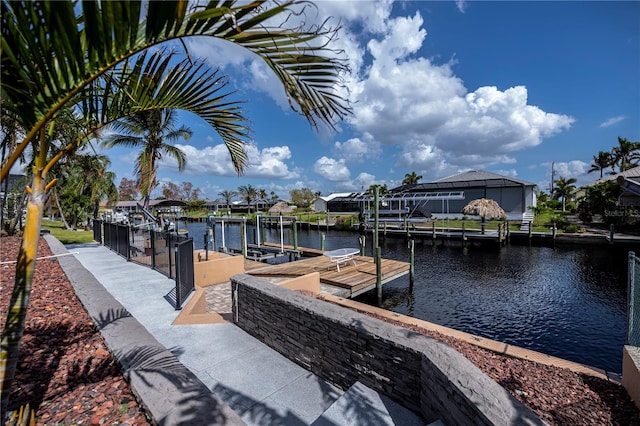 dock area featuring a lanai and a water view