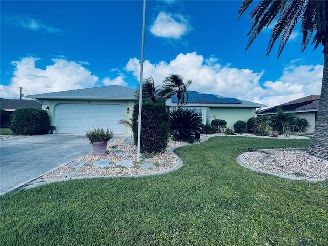 view of front facade with a garage and a front yard