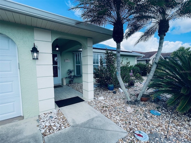 doorway to property featuring a garage