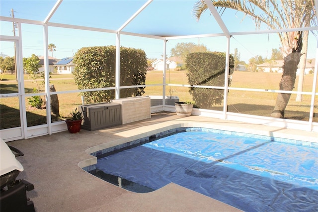 view of pool featuring a lanai and a patio area