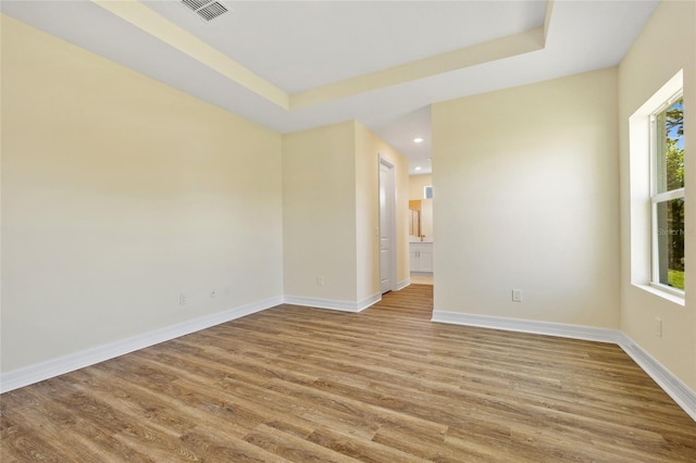 1293 Preston St, Port Charlotte, FL 33952 - unfurnished room featuring wood finished floors, recessed lighting, and a raised ceiling